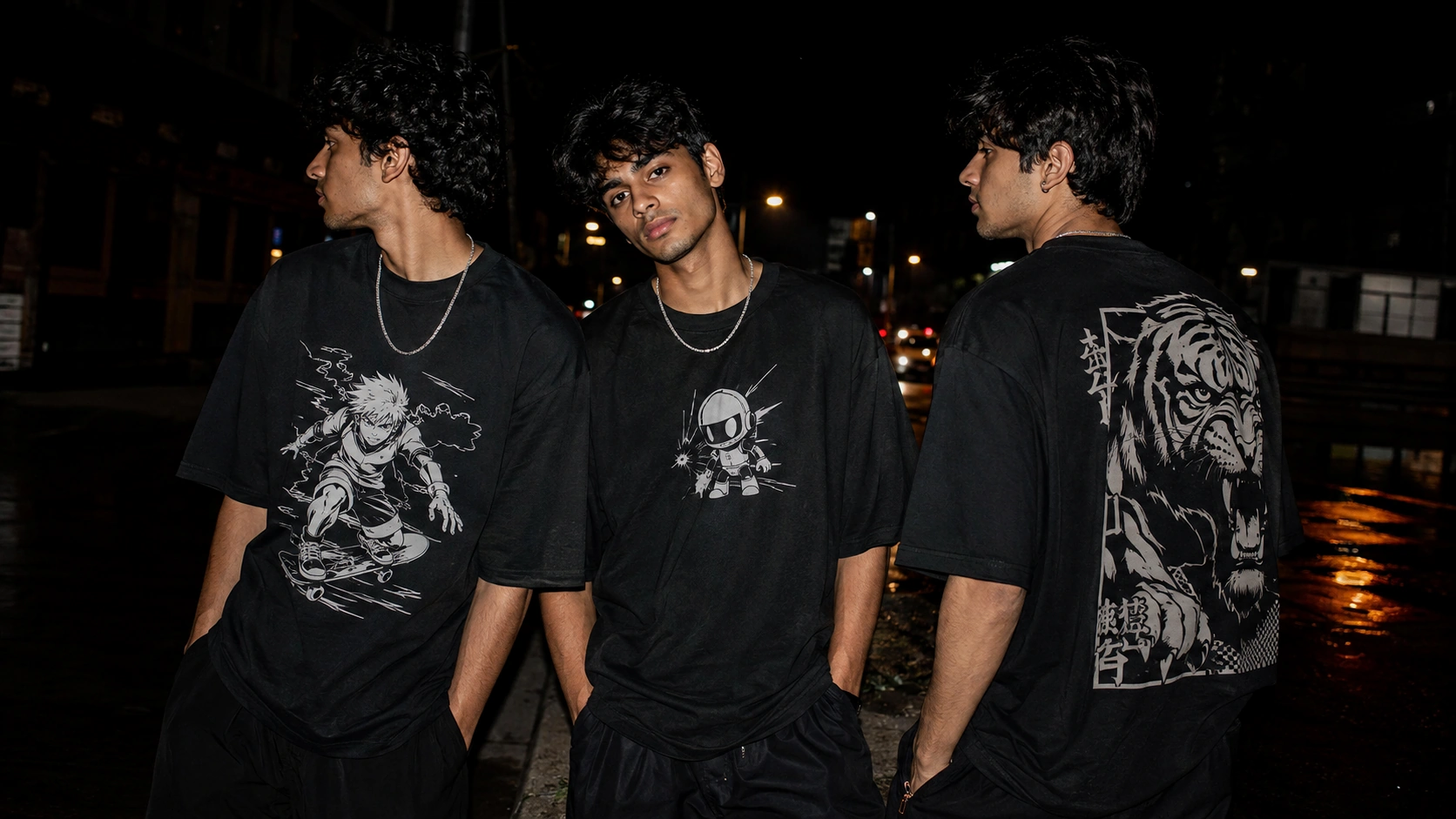 Three young men wearing black graphic T-shirts on a city street at night